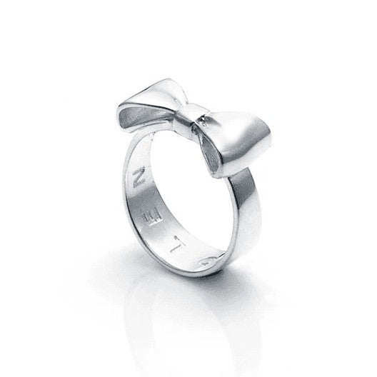  STOLEN GIRLFRIENDS CLUB BOW RING  The Stolen Girlfriends Club Bow Ring is an iconic style favourite. The Club Bow Ring is crafted in high polish sterling silver, and features signature "STOLEN' engraving inside the band. The Stolen Girlfriends Club Bow Ring has a thicker band, making it great to wear alone or stack in your style.  - Sterling silver - Comes in Stolen Girlfriends Club Jewellery box