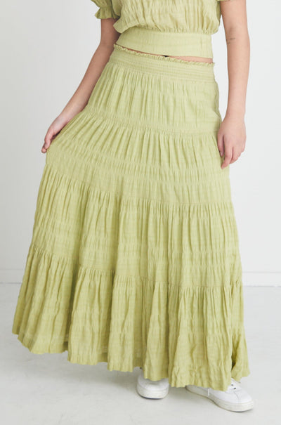 The Charming Pistachio Maxi Skirt is a stunning everyday skirt. Complete the set with the Siena Pistachio Tie Back Top. Maxi length Shirred waist Tiered skirt Main: 95% Cotton 5% Spandex Lining: 100% Cotton