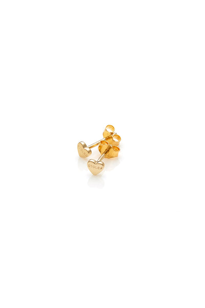 STOLEN GIRLFRIENDS CLUB TINY STOLEN HEART EARRINGS  The Stolen Girlfriends Club Tiny Stolen Heart Earrings make the perfect gift for someone special. They are a stud style, crafted from gold plating and engraved with the signature 'STOLEN' logo.   See the third image for size diffe