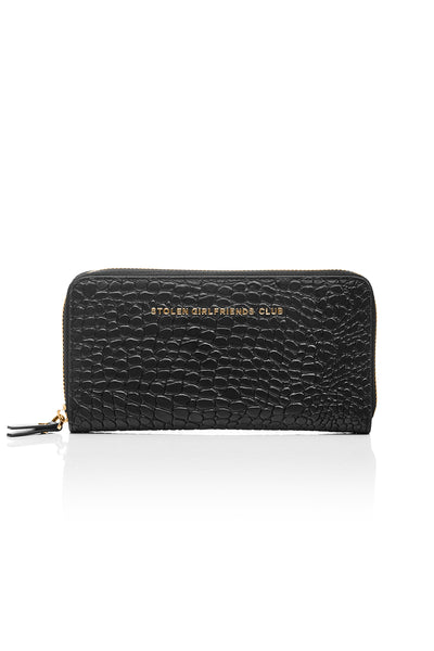 Taken from classic bourgeois silhouettes of the ’60s and given a rock n roll reinvention, we introduce our Big Trouble Wallet in our updated matte black colorway. Designed with sharp corners, cleaner lines, and angular features, this style has more structure and feels almost architectural. Beautifully crafted in a rich crocodile-effect texture, this has a modernized matte leather finish.