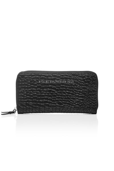 Taken from classic bourgeois silhouettes of the ’60s and given a rock n roll reinvention, we introduce our Big Trouble Wallet in our updated matte black colorway. Designed with sharp corners, cleaner lines, and angular features, this style has more structure and feels almost architectural. Beautifully crafted in a rich crocodile-effect texture, this has a modernized matte leather finish.