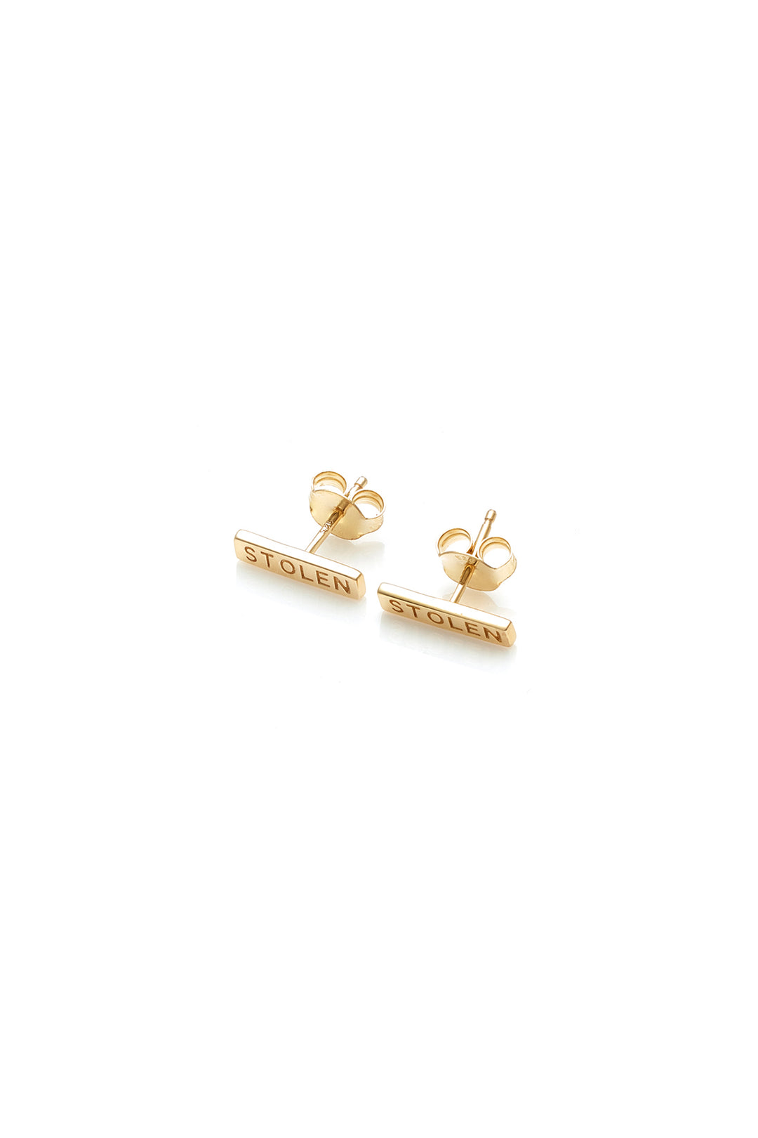   STOLEN GIRLFRIENDS CLUB TINY STOLEN BAR EARRINGS  The Stolen Girlfriends Club Stolen Bar Earrings are the perfect gift for a Stolen fan. They are a stud earring with a 1.3cm gold plated bar featuring the words "STOLEN" engraved on each.       Engraved "STOLEN"     18k Gold plated     Sold as a pair 