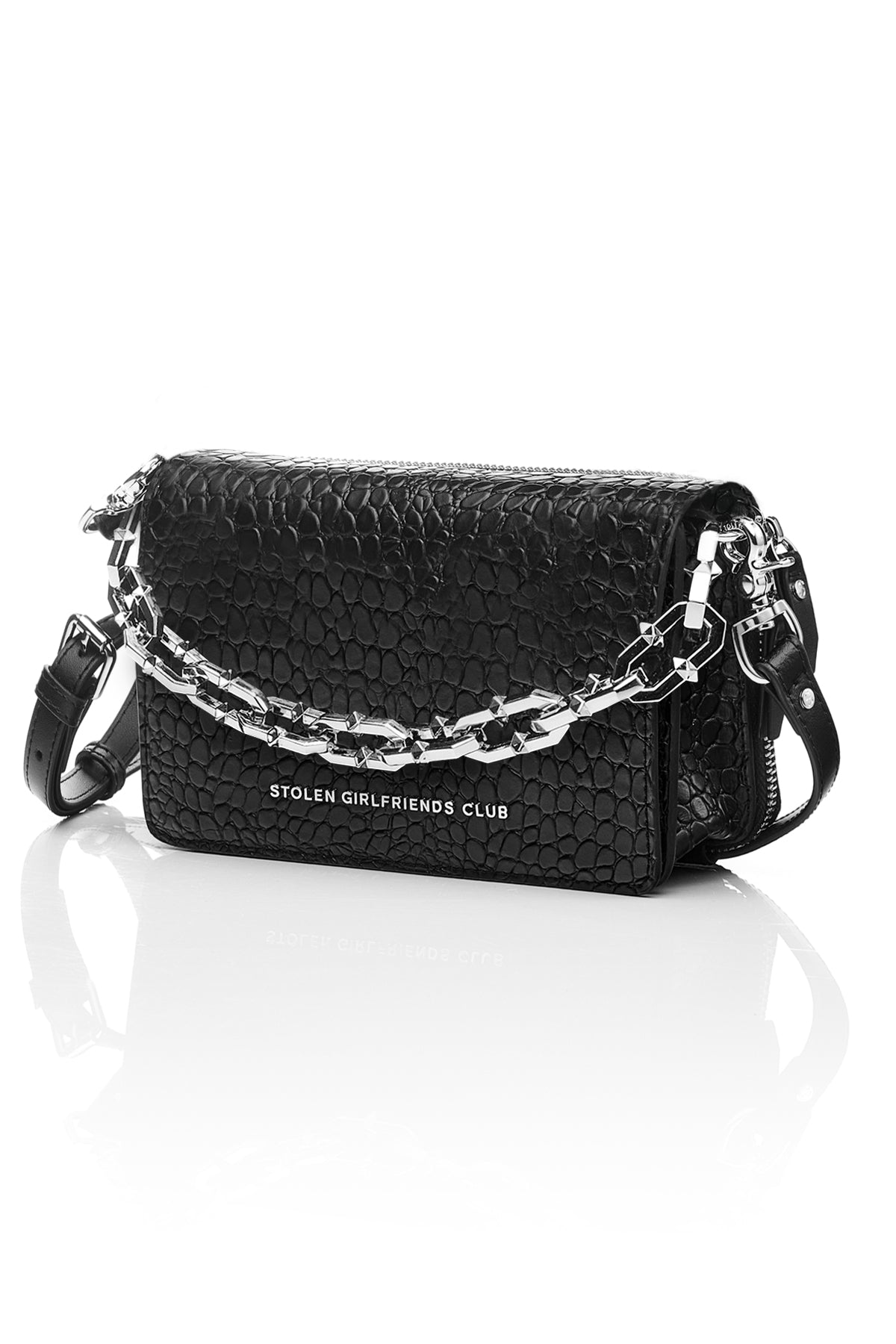 The Stolen Girlfriends Club Little Trouble Bag is an edgy crossbody bag, now available in Matte Black.  Crafted in 100% genuine leather and features a funky crocodile texture throughout.  The Little Trouble Bag opens via a magnetic flap, and features a metal 'Stolen Girlfriends Club' plaque at the front, internal card slots, two internal zipper pockets, and comes with plain self and optional chunky chain straps.
