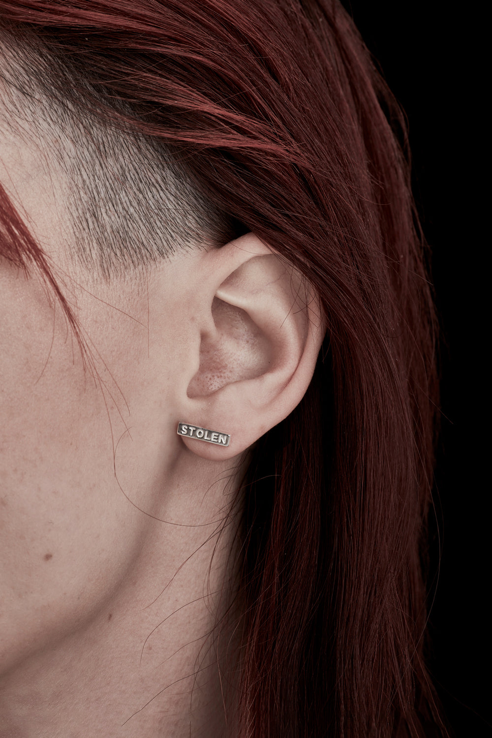   STOLEN GIRLFRIENDS CLUB TINY STOLEN BAR EARRINGS  The Stolen Girlfriends Club Stolen Bar Earrings are the perfect gift for a Stolen fan. They are a stud earring with a 1.3cm sterling silver bar featuring the words "STOLEN" engraved on each.       Engraved "STOLEN"     Sterling Silver      Sold as a pair 