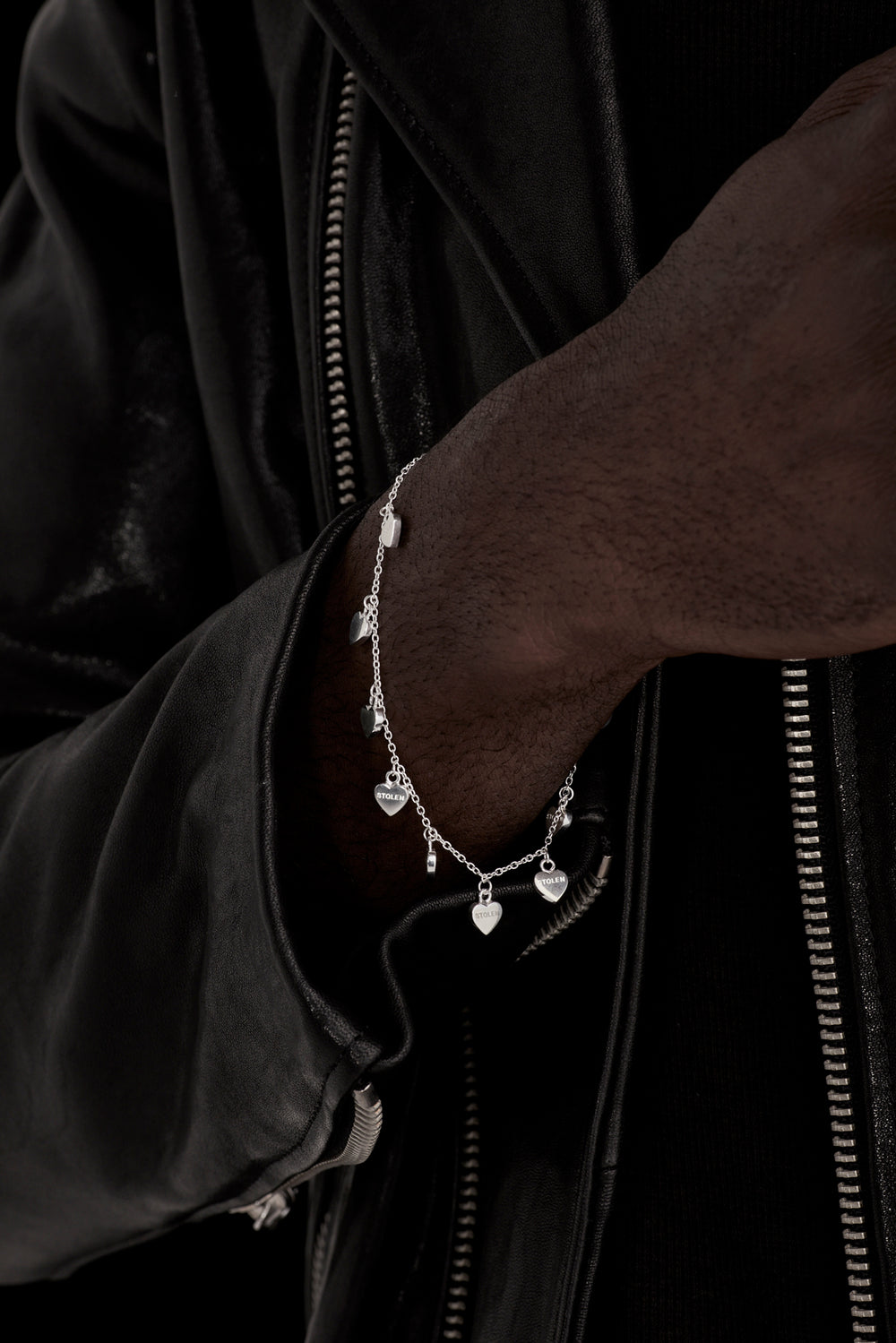 STOLEN GIRLFRIENDS CLUB STOLEN HEART BRACELET  The Stolen Girlfriends Club Stolen Heart Bracelet is a delicate bracelet featuring eight mini hearts, all connected to the fine chain in a hanging charm style, closing with a thick clasp. Layer with other Stolen bracelets, or alone for some simple sophistication.      19cm chain length      High polished sterling silver     Comes in a Stolen Girlfriends Club jewellery box