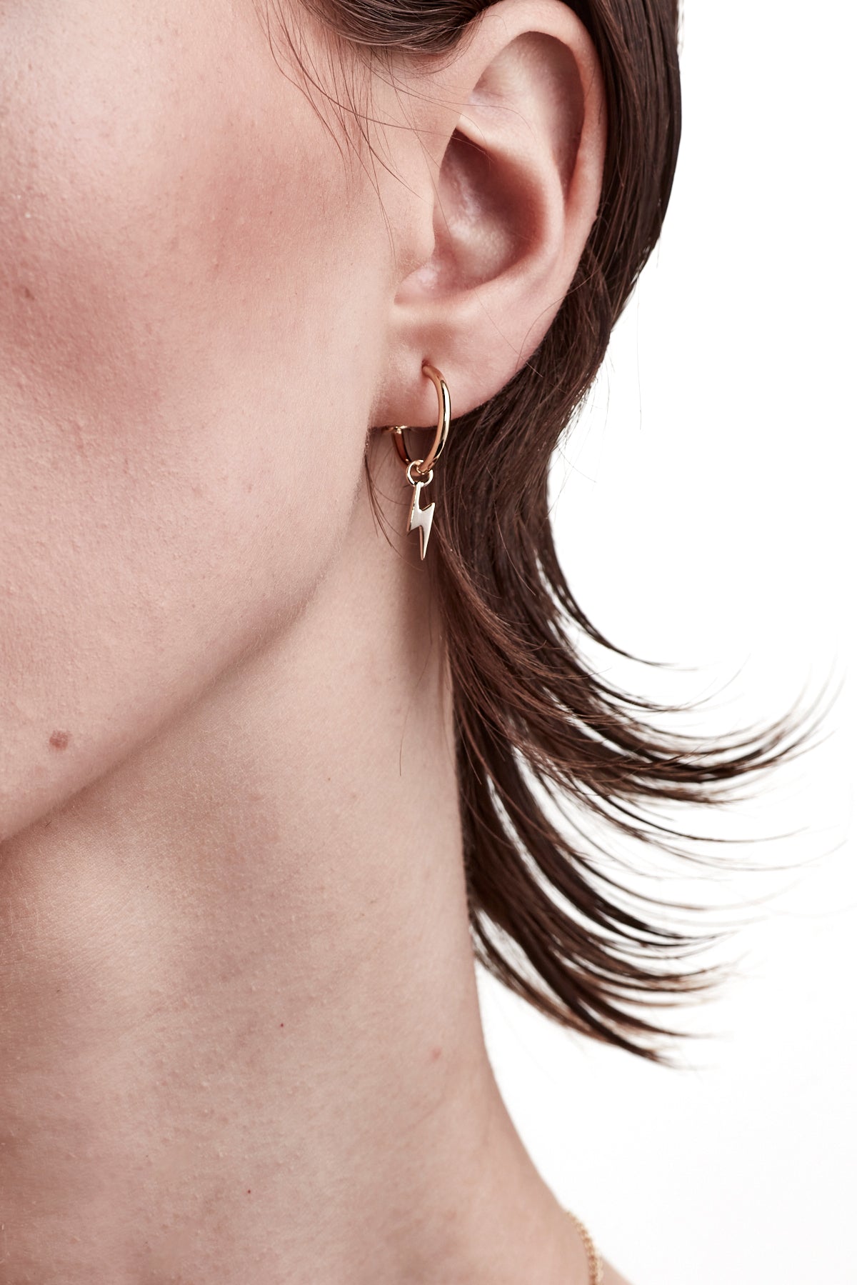 STOLEN GIRLFRIENDS CLUB BOLT ANCHOR SLEEPER  The Stolen Girlfriends Club Bolt Anchor Sleepers are gorgeous half hoop stud-style earrings, each suspending cute mini lightening bolt charms.  Crafted using gold plating, these little lightening bolts are great for every day wear.  Pair with other studs, or match with the matching I'll Be Lightening Earrings.      Half hoop stud-style earrings