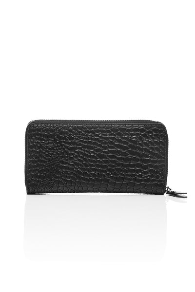 Taken from classic bourgeois silhouettes of the ’60s and given a rock n roll reinvention, we introduce our Big Trouble Wallet in our updated matte black colorway. Designed with sharp corners, cleaner lines, and angular features, this style has more structure and feels almost architectural. Beautifully crafted in a rich crocodile-effect texture, this has a modernized matte leather finish.