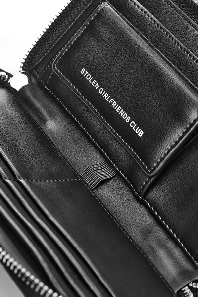 Taken from classic bourgeois silhouettes of the ’60s and given a rock n roll reinvention, we introduce our Big Trouble Wallet in our updated matte black colorway. Designed with sharp corners, cleaner lines, and angular features, this style has more structure and feels almost architectural. Beautifully crafted in a rich crocodile-effect texture, this has a modernized matte leather finish.