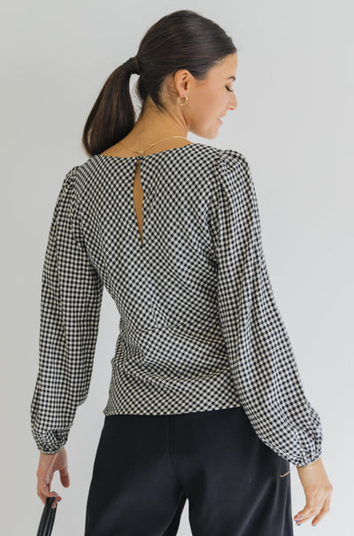Among The Brave Bailey Bias Balloon Sleeve Top - Black Gingham  The Bailey top from Among the Brave is an elegant staple you need in your wardrobe. It features long balloon sleeves and is a bias cut. Available in a black and white gingham this top will elevate any look, We love how this top styles with black dress pants, heels and a blazer.      Long balloon sleeves     Panel bodice     Bias cut     Lined