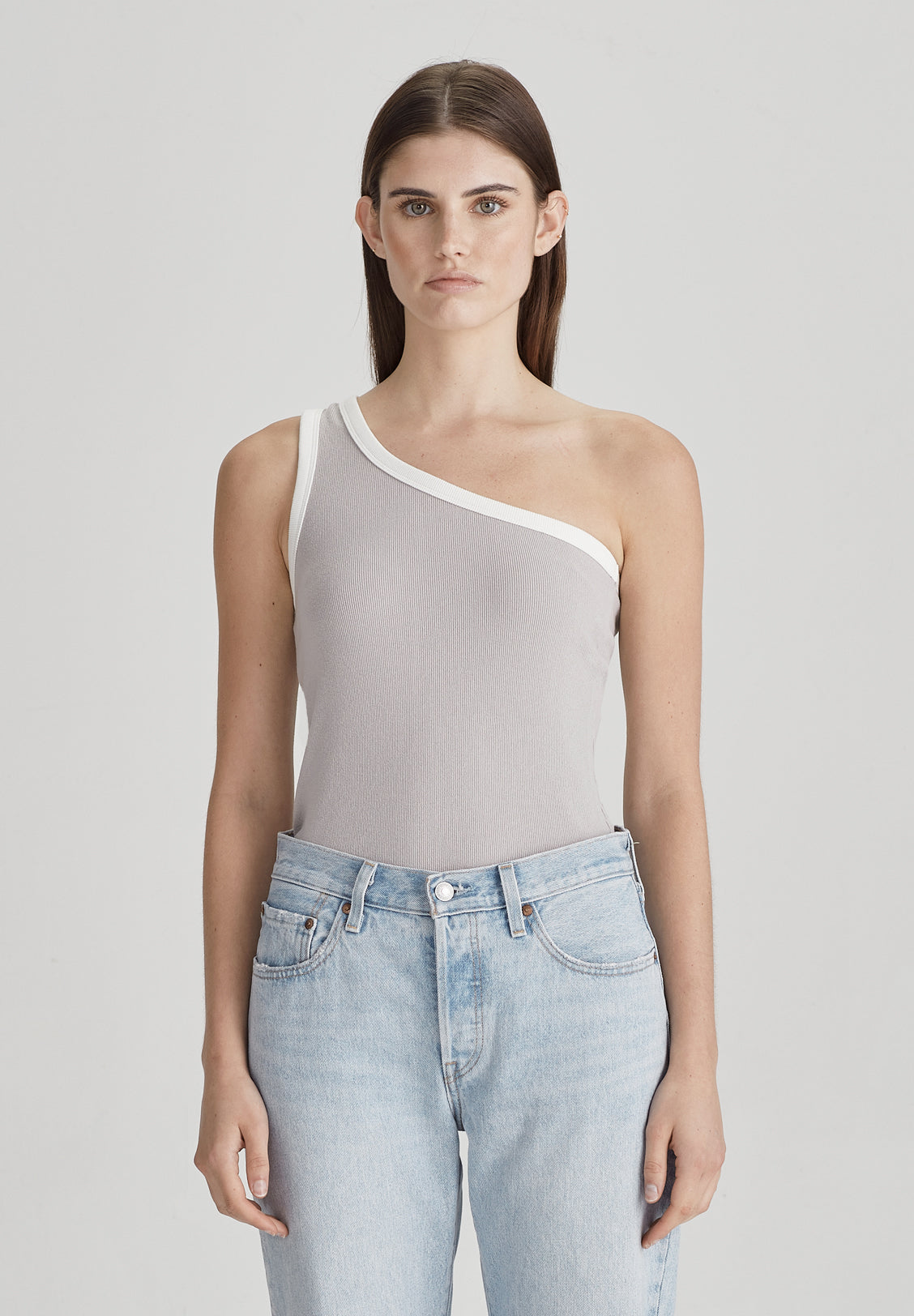 The Commoner One Shoulder Rib Tank is an updated classic featuring a contrast white trim. Its asymmetric design is a fun flattering style. Team back with denim for an easy summer fit.      Designed to be worn close fitted.     Crafted from 98% cotton / 2% span – stretch tight rib.     Asymmetric sleeve design.