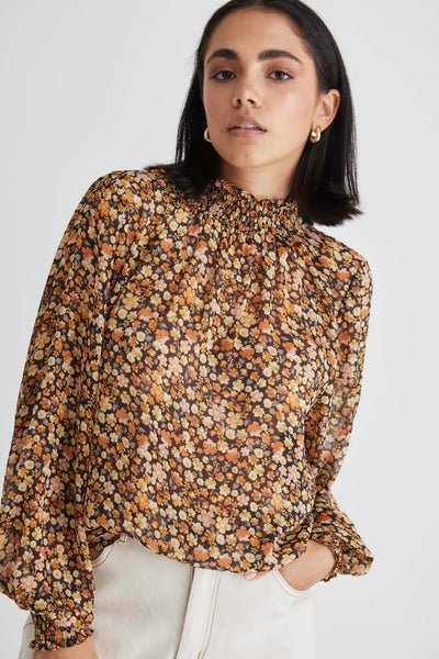The Embrace High Neck Shirred Top has to be one of our top picks. Now available in this gorgeous black spice floral, you are sure to turn heads. It features a shirred high neck and it finished with matching shirred cuffs. An easy throw-on and go style taking you from day to night.   High neck  Shirring detail Floral print 100% Polyester