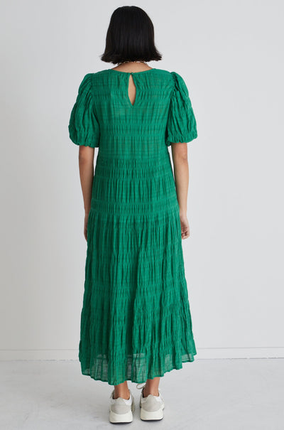 The Among The Brave Graceful Dress in Palm is a stunning maxi styled dress, crafted in 100% textured cotton with a tiered skirt and and puffed sleeves.  Perfect to dress up and wear to an event, or wear casually as everyday wear.      Sizes: 8,10,12,14     Cotton lining     Tiered style     100% Cotton
