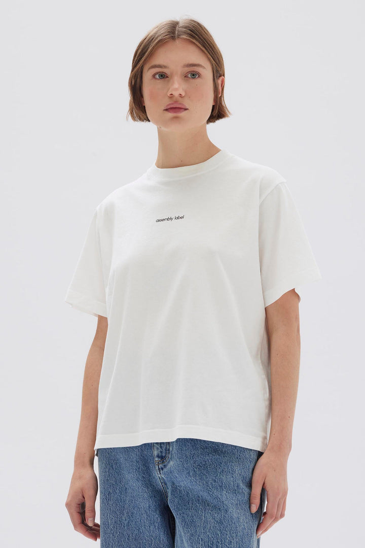 Assembly Label Exhibited Print Short Sleeve Tee | Antique White & Black