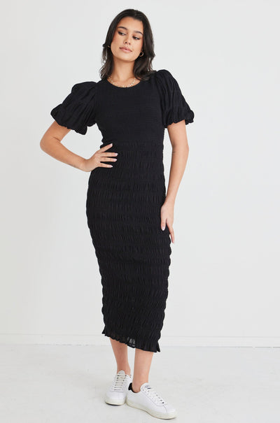 The Jade Black Dress by Ivy + Jack is here to be your forever favourite! Featuring an elegant and flattering ruched body, and gorgeous puff sleeves that create a stunning silhouette, this dress won't let you down. Pair with some little black heels for an evening look or white sneakers and a crossbody bag for daytime styling.       Ruched Bodycon     Puff sleeves      Round neckline     Stretch Material      Midi length 