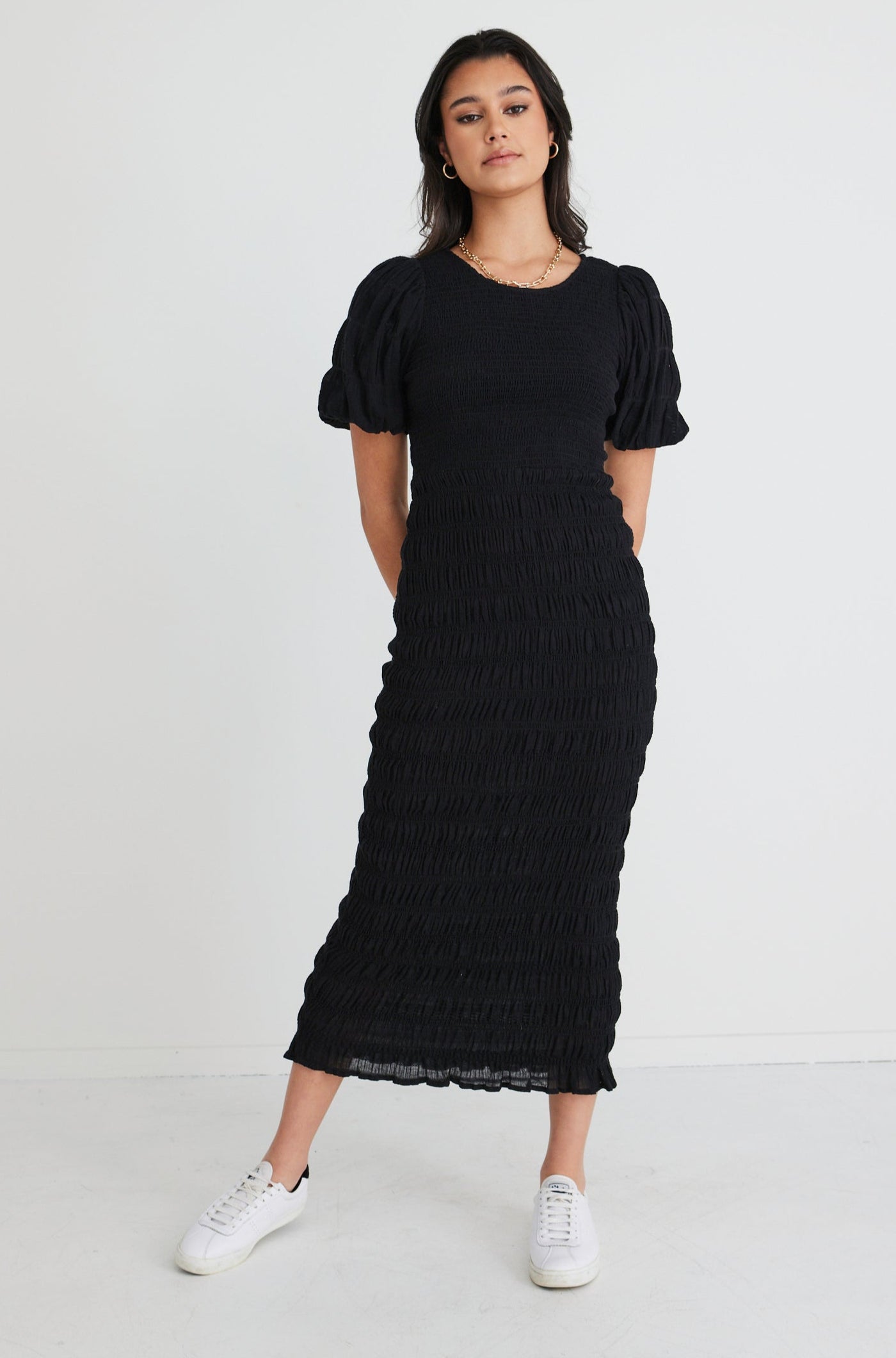 The Jade Black Dress by Ivy + Jack is here to be your forever favourite! Featuring an elegant and flattering ruched body, and gorgeous puff sleeves that create a stunning silhouette, this dress won't let you down. Pair with some little black heels for an evening look or white sneakers and a crossbody bag for daytime styling.       Ruched Bodycon     Puff sleeves      Round neckline     Stretch Material      Midi length 