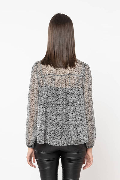Leila + Luca Radiant Bow Top - Mono Daisy  The Leila + Luca Radiant Bow Top is available in this gorgeous mono daisy print. It features a high neck with tie, although can be worn undone with a n neck for multiple ways to wear. This sheer top teams perfectly back with any bottoms.       Neck tie detail     Elasticated cuffs     Sheer fabric     100% Polyester 