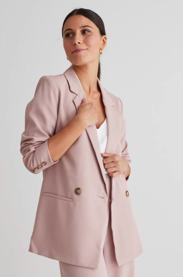 From work to drinks with the girls, the Mason Blazer has got you covered! This blazer features a boyfriend fit, and double-breasted button detailing to instantly elevate your outfit.      Boyfriend fit     Double-breasted button detailing     Lined     Pockets     85% Polyester, 5% Rayon, 10% spandex, Lining: 100% Polyester     Please note pockets are sewn shut to keep the blazer looking fresh and tailored 