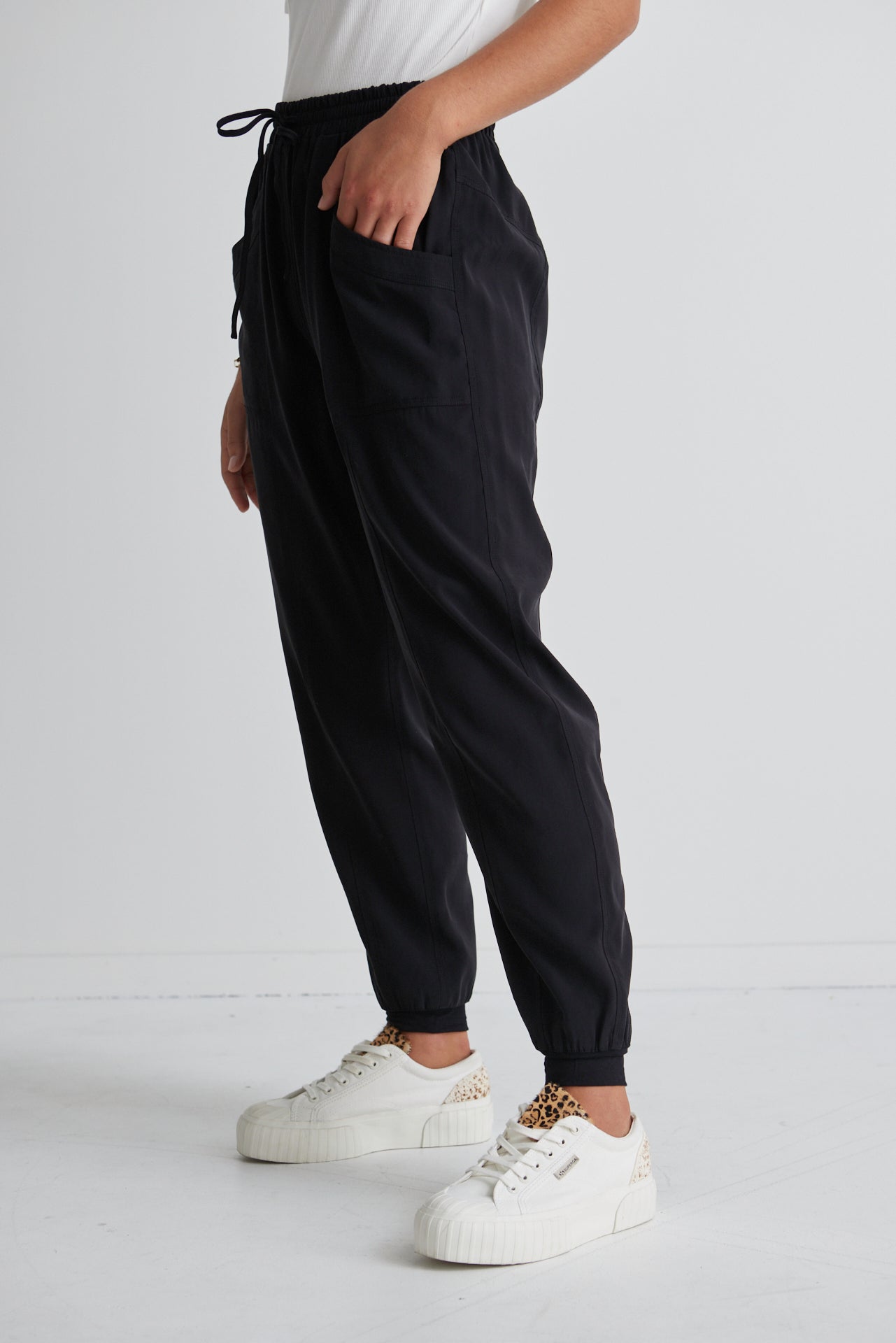 These New Warrior Relaxed Drapey Pants will be some of the comfiest pants you own! Comfy enough to wear around the house or while working from home, but slip on some sneakers or slides and you'll be ready to head out the door. Comfort meets style it's a yes from us!  88% Rayon 12% Polyester