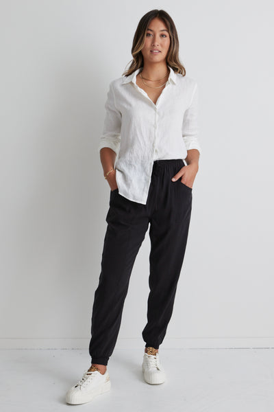 These New Warrior Relaxed Drapey Pants will be some of the comfiest pants you own! Comfy enough to wear around the house or while working from home, but slip on some sneakers or slides and you'll be ready to head out the door. Comfort meets style it's a yes from us!  88% Rayon 12% Polyester