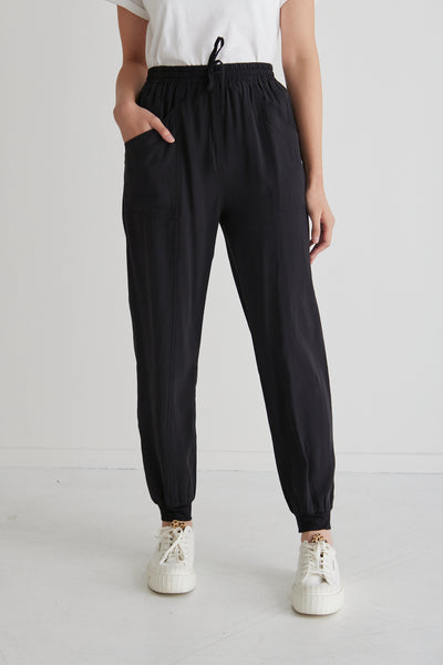 These New Warrior Relaxed Drapey Pants will be some of the comfiest pants you own! Comfy enough to wear around the house or while working from home, but slip on some sneakers or slides and you'll be ready to head out the door. Comfort meets style it's a yes from us!  88% Rayon 12% Polyester Soft Sandwashed Fabric