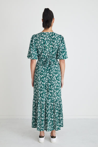 The Ocean Green Ditsy Ss Wrap Midi Dress from Among the Brave is a stand-out dress. In our green ditsy print with flattering cut and wrap feature, this piece is one you'll love forever!    - Wrap dress - Midi length  - Slit at mid-thigh - Beautiful flowy skirt - 100% Viscose