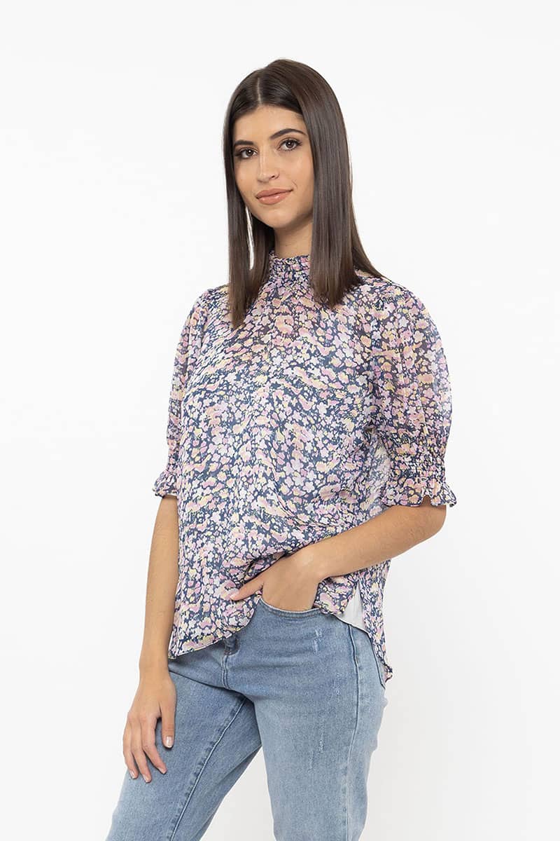 The Seeking Lola Notting Hill Top is such a sweetie in this lovely pink surprise print. This top features a shirred high neckline and frill cuff sleeves. Team with your favourite denim for an effortless look.  Shirred details  Frill sleeves High neckline 100% Polyester 