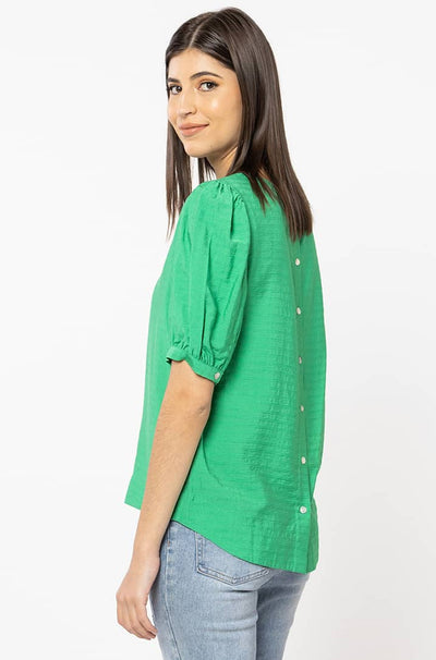 The Seeking Lola Choice Top is available in a stunning vibrant emerald colour and is crafted from a lovely textured fabric. It features slightly puffed sleeves, a crew neckline and is finished with shell buttons down the back of the top. Team the Choice Top back with your favourite denim or bottoms. 