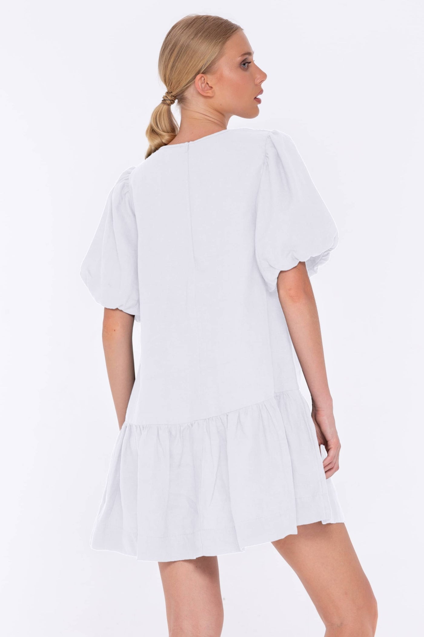 The linen Like Honey Dress will be your go to mini this summer, it features a deep v-neckline, short ballooned sleeves and a dropped waist into a gathered skirt.  White linen Mini Length Deep v-neckline Short ballooned sleeves Dropped waistline Gathered skirt