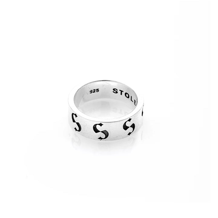STOLEN GIRLFRIENDS CLUB S-LOGO IMPRINT BAND NARROW  The Stolen Girlfriends Club S-Logo Imprint band is available in a narrow cut, and features oxidised black out signature 'Stolen S's' around the outer band, and matching oxidised blaked out 'STOLEN' on the inner band. 
