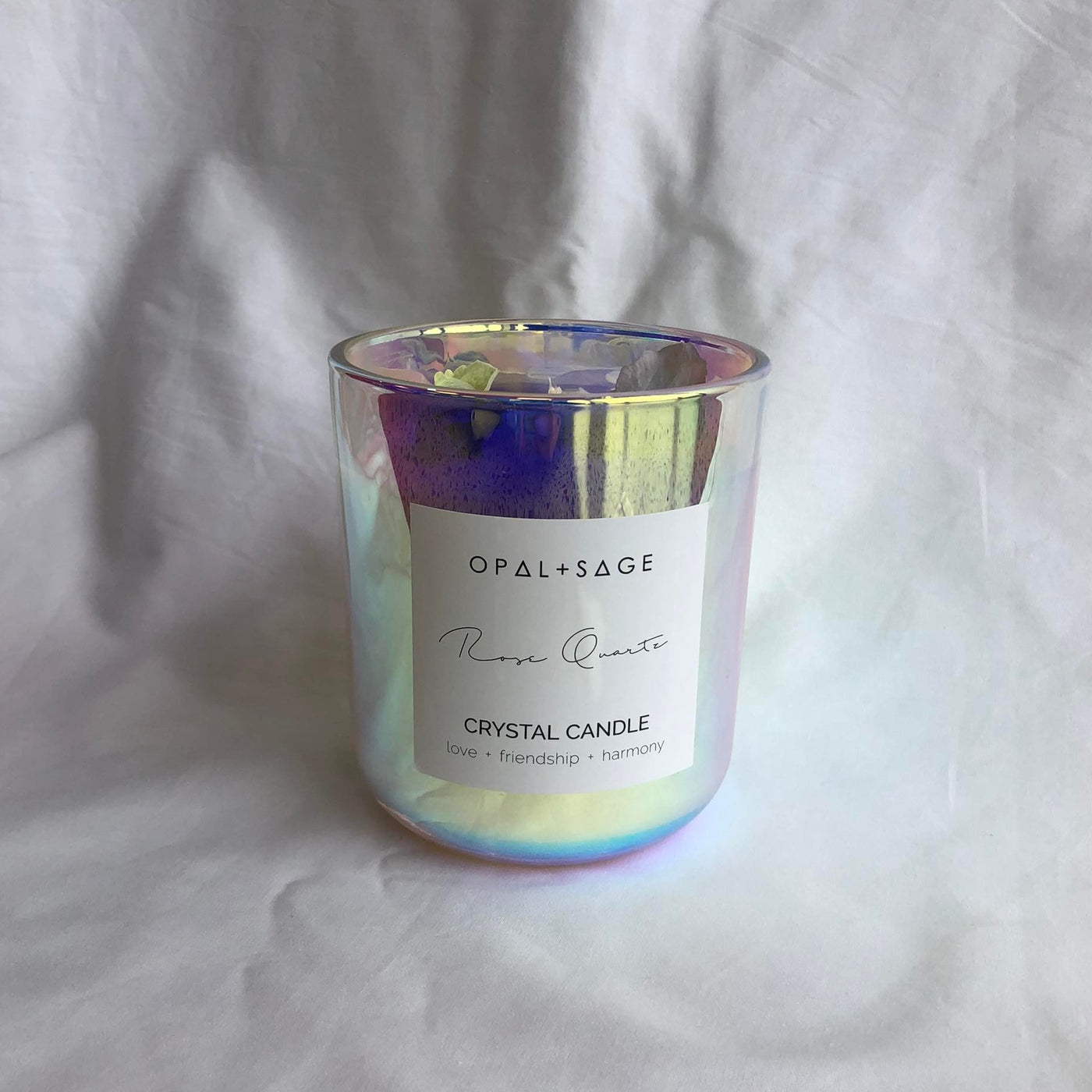 OPAL + SAGE DREAM JAR CANDLE  The Opal + Sage Dream Jar Candles are scented candles, decorated with a crystal and botanical petals; now available in; Rose Quartz and Amethyst.  The Opal + Sage Dream Jar Candles is a luxury soy candle, which has a lustre effect once lit and is a great addition to any room, they also make wonderful gifts.  The Opal + Sage Rose Quartz Candle comes in an iridescent glass container and was hand poured with love in Mapua New Zealand. 