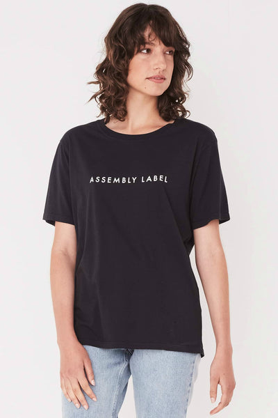 ASSEMBLY LABEL LOGO COTTON CREW TEE  The Assembly Label Logo Cotton Crew Tee is a classic slogan tee perfect for every day wear. The Logo Cotton Crew is the t-shirt version of the cult favourite Assembly Label Logo Fleece  The Assembly Label Logo Cotton Crew Tee features a relaxed silhouette and crew neckline, finishing with signature 'Assembly Label' screen print across the chest. 