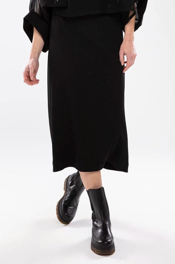 NES RIB SKIRT - BLACK  The Nes Rib Skirt is a simple staple perfect for the changing seasons.  The Rib Skirt is a mid-length bias cut skirt ideal for dressing up or down. The Rib Skirt speaks for itself with its r