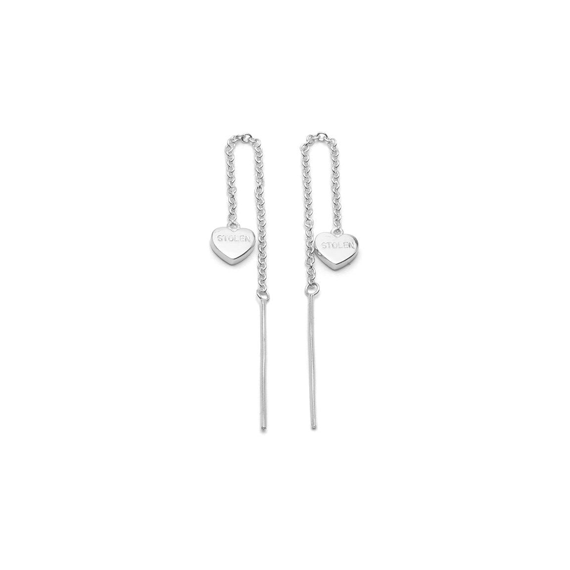 STOLEN GIRLFRIENDS CLUB - FALLING STOLEN HEART EARRINGS  The Stolen Girlfriends Club Falling Stolen Heart Earrings are a thread style. Both earrings feature the word "STOLEN" engraved on a high gloss sterling silver heart at each end. They are a simple dainty style that will add a little edge to any outfit. If you have many piercings they can be layered with other Stolen Girlfrien
