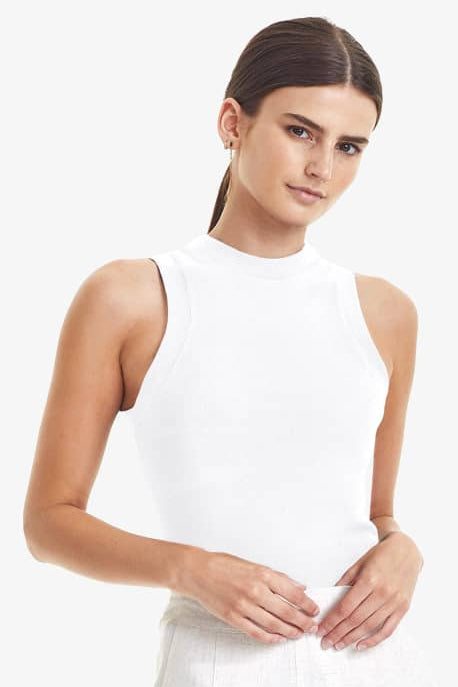 COMMONERS HIGH NECK TANK - WHITE  The Commoners High Neck Tank is a neutral essential ideal for the warming seasons.  The High Neck Tank speaks for itself; it is a high neck tank with a fitted silhouette, and fine ribbing throughout.  Simple, stylish, and versatile, The Commoners High Neck Tank is crafted using organic cotton, making it soft and breathable.      Sizes; 6, 8, 10, 12     Fitted     High neckline     fine ribbing throughout     100% Organic Cotton 