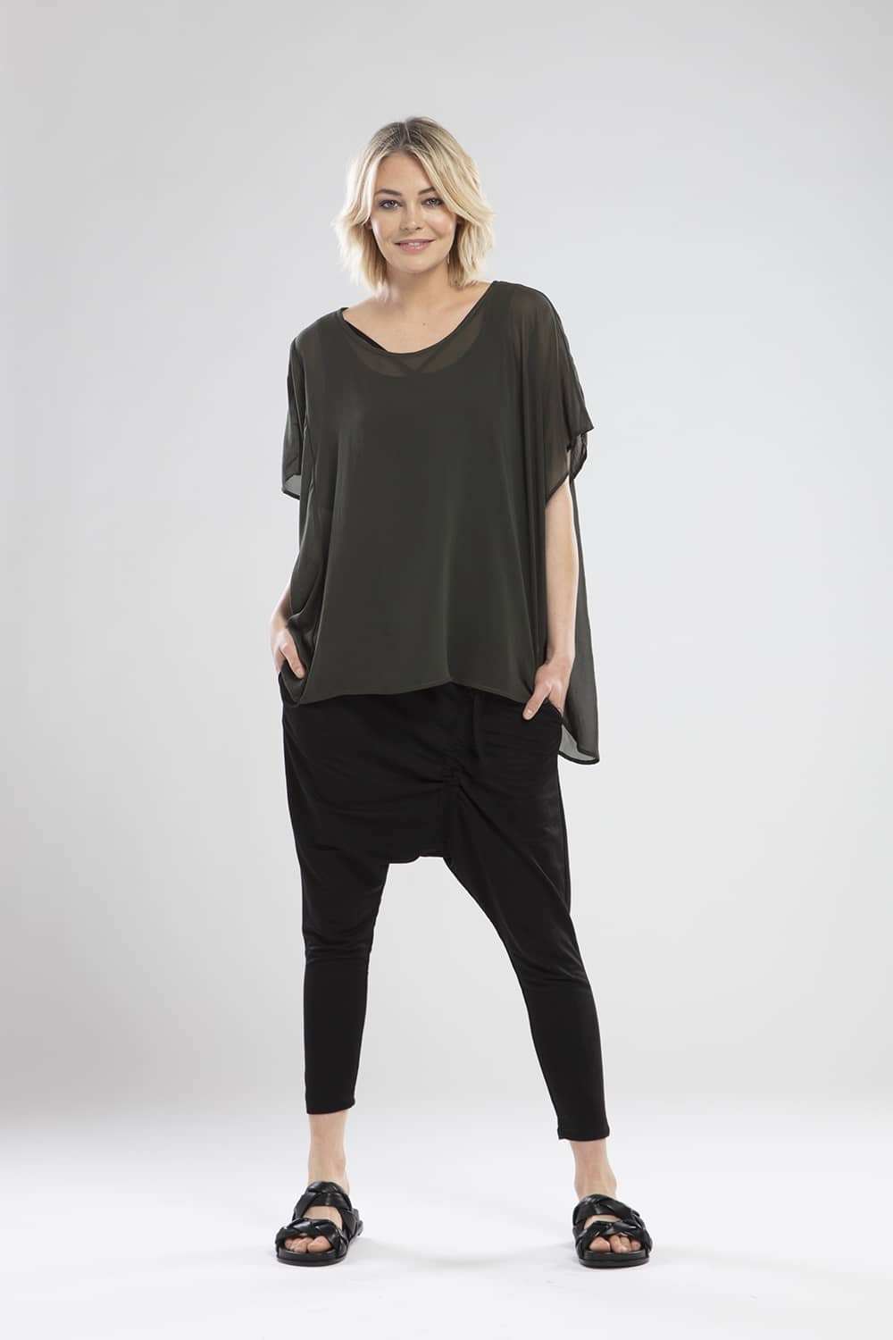NES CIVITA TOP  The Nes Civita Top is a sheer staple for everyday wear. Crafted from 100% polyester, this easy to wear top is loose and flowing, with angled sleeves and a slight drop tail, featuring a split detail on the left side, ideal for tying up or tucking in.   See the Nes Civita Top teamed back with the Nes Roxi Pant in black  Sizes S/M , M/L 100% Polyester Angled sleeves Slight drop tail Left side split detail