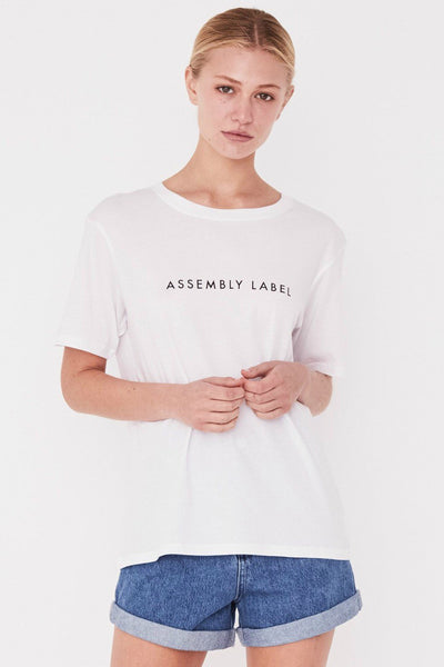 ASSEMBLY LABEL LOGO COTTON CREW TEE  The Assembly Label Logo Cotton Crew Tee is a classic slogan tee perfect for every day wear. The Logo Cotton Crew is the t-shirt version of the cult favourite Assembly Label Logo Fleece  The Assembly Label Logo Cotton Crew Tee features a relaxed silhouette and crew neckline, finishing with signature 'Assembly Label' screen print across the chest. 