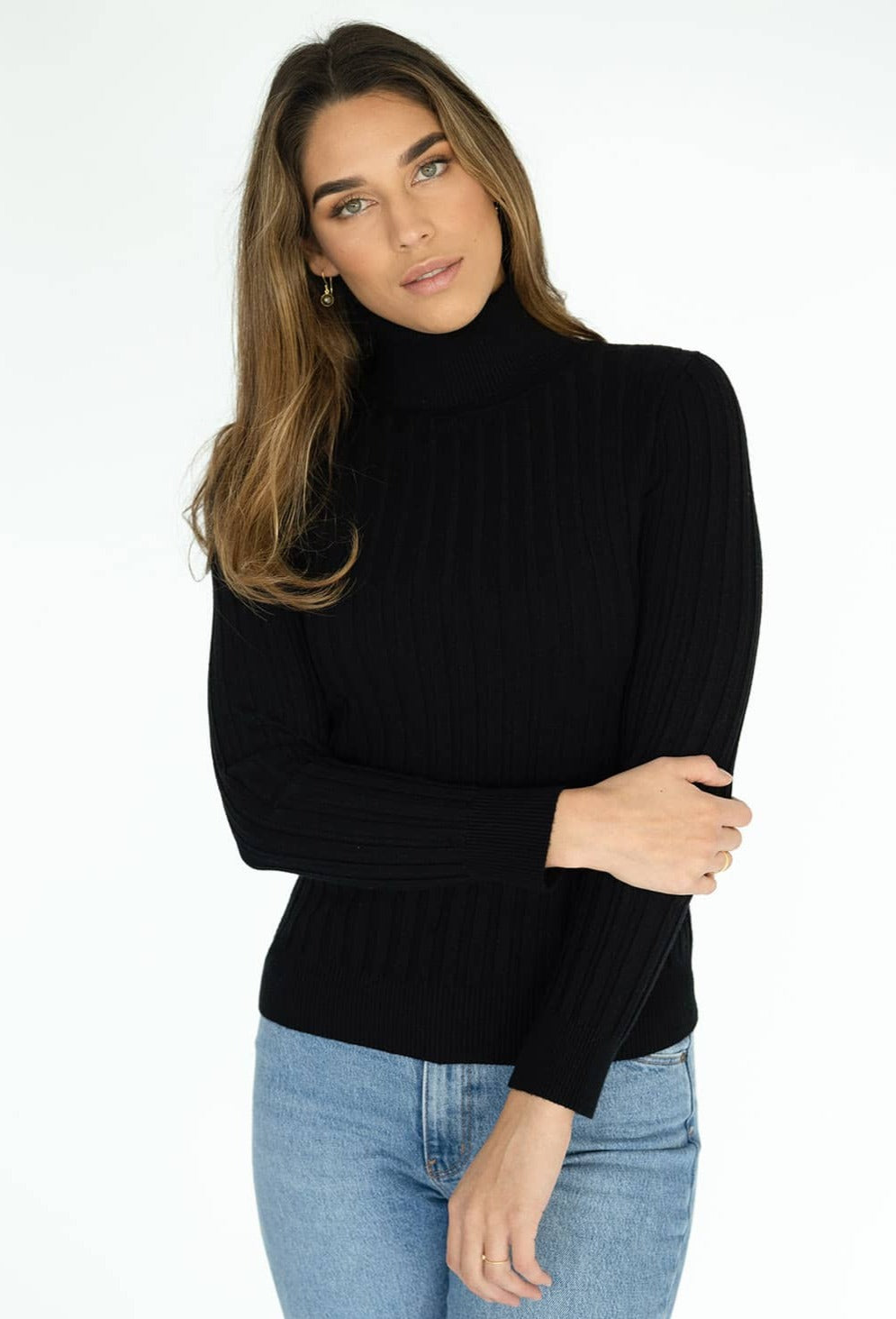 HUMIDITY INES SKIVVY  The Humidity Ines Skivvy is now available in Mocha and Black. It is crafted in a viscose/nylon/polyester blend which gives a super soft feel on the skin. It is a perfect basic high-neck skivvy to layer or wear on its own.       Sizes: XS, S, M, L     50% Viscose/28% Nylon/22% Polyester.     Available in mocha and black