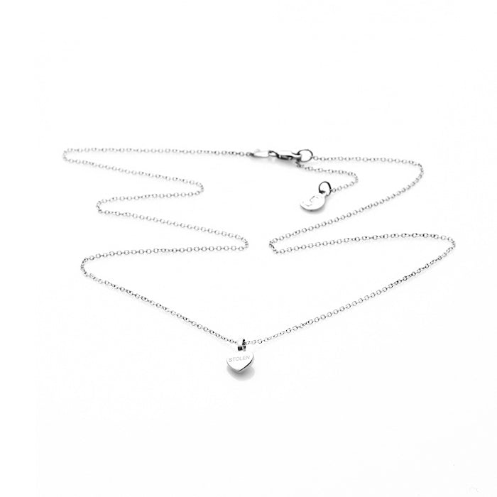 STOLEN GIRLFRIENDS CLUB STOLEN HEART NECKLACE  The Stolen Girlfriends Club Stolen Heart Necklace is a fine feminine necklace perfect for daily or occasion wear.  The Stolen Heart Necklace features a fine chain, suspending a fine heart with with a signature 'Stolen' engraved through the middle. Simple, stylish and easy-to-wear  Wear The Stolen Girlfriends Club Stolen Heart Necklace back with the matching Stolen Girlfriends Club Heart Earrings to add style to any outfit 