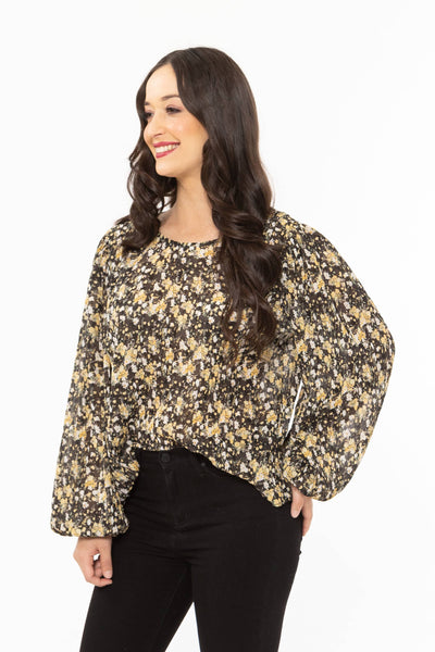 The Carefree Top is available in this lovely soft yellow and black floral print. It is a boxy style fit with bell sleeves finished with elasticated cuffs. This crinkle fabric can be worn day or night.   100% polyester crinkle fabric elasticated cuffs bell sleeves  generous fit