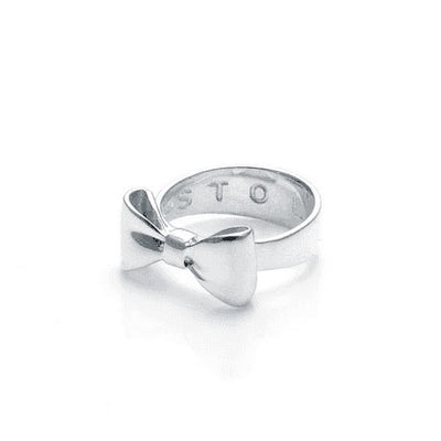  STOLEN GIRLFRIENDS CLUB BOW RING  The Stolen Girlfriends Club Bow Ring is an iconic style favourite. The Club Bow Ring is crafted in high polish sterling silver, and features signature "STOLEN' engraving inside the band. The Stolen Girlfriends Club Bow Ring has a thicker band, making it great to wear alone or stack in your style.  - Sterling silver - Comes in Stolen Girlfriends Club Jewellery box