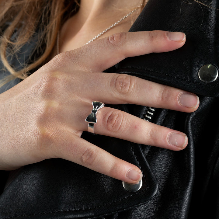  STOLEN GIRLFRIENDS CLUB BOW RING  The Stolen Girlfriends Club Bow Ring is an iconic style favourite. The Club Bow Ring is crafted in high polish sterling silver, and features signature "STOLEN' engraving inside the band. The Stolen Girlfriends Club Bow Ring has a thicker band, making it great to wear alone or stack in your style.  - Sterling silver - Comes in Stolen Girlfriends Club Jewellery box