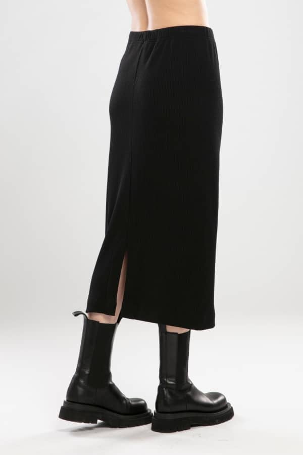 NES RIB SKIRT - BLACK  The Nes Rib Skirt is a simple staple perfect for the changing seasons.  The Rib Skirt is a mid-length bias cut skirt ideal for dressing up or down. The Rib Skirt speaks for itself with its r