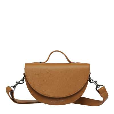 STATUS ANXIETY ALL NIGHTER BAG - TAN  The Status Anxiety All Nighter Bag is a simple stylish cross body bag, perfect for daily use as it easily fits all your essentials, and can also be carried by the top handle for an alternative bag style.