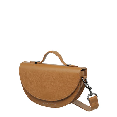 STATUS ANXIETY ALL NIGHTER BAG - TAN  The Status Anxiety All Nighter Bag is a simple stylish cross body bag, perfect for daily use as it easily fits all your essentials, and can also be carried by the top handle for an alternative bag style.
