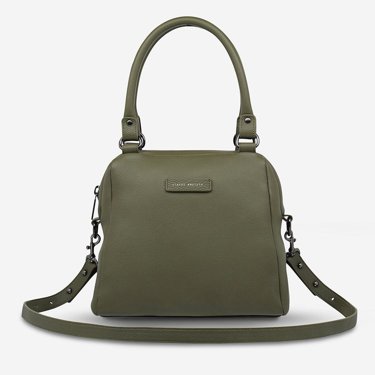 STATUS ANXIETY LAST MOUNTAINS BAG  The Status Anxiety Last Mountains Bag is the perfect bag for us girls who need a bigger bag for all our daily essentials!  In trendy Tan, Khaki, Green, Black Bubble or Navy Blue, this compact yet tall design was crafted using soft shrunken Brazilian pebble leather.  This bag features signature 'Status Anxiety' stamping on the fr