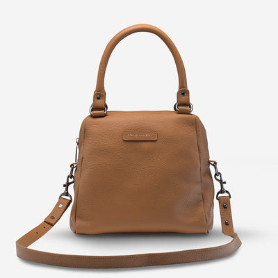 STATUS ANXIETY LAST MOUNTAINS BAG  The Status Anxiety Last Mountains Bag is the perfect bag for us girls who need a bigger bag for all our daily essentials!  In trendy Tan, Khaki, Green, Black Bubble or Navy Blue, this compact yet tall design was crafted using soft shrunken Brazilian pebble leather.  This bag features signature 'Status Anxiety' stamping on the fr