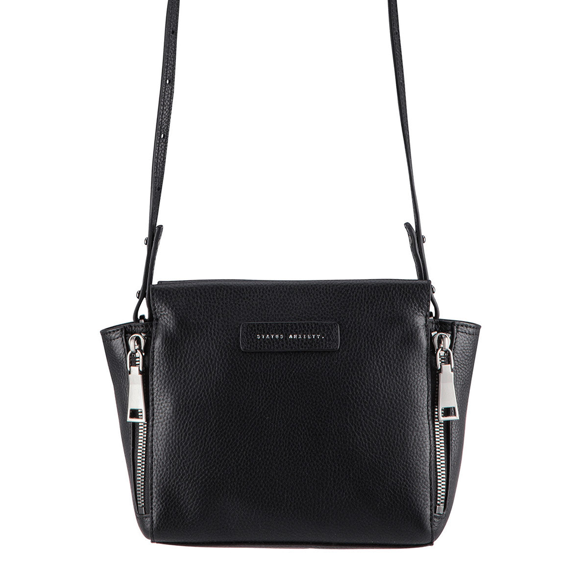 STATUS ANXIETY ASCENDANTS HANDBAG  The Status Anxiety Ascendants handbag is an edgy modern handbag.  The perfect size to fit all the essentials, the Ascendants bag features oversized zipper detailing, with magnetic closure for security. This bag is the perfect way to dress up your outfit. 