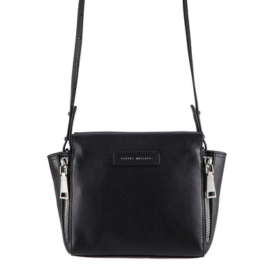 STATUS ANXIETY ASCENDANTS HANDBAG  The Status Anxiety Ascendants handbag is an edgy modern handbag.  The perfect size to fit all the essentials, the Ascendants bag features oversized zipper detailing, with magnetic closure for security. This bag is the perfect way to dress up your outfit. 