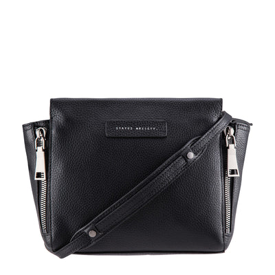STATUS ANXIETY ASCENDANTS HANDBAG  The Status Anxiety Ascendants handbag is an edgy modern handbag.  The perfect size to fit all the essentials, the Ascendants bag features oversized zipper detailing, with magnetic closure for security. This bag is the perfect way to dress up your outfit. 