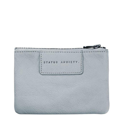 Status Anxiety Anarchy Purse The Status Anxiety Anarchy Purse is a trendy yet practical coin purse. Featuring space for cards, coins, a lipstick and folded notes. Take the Anarchy purse on its own or chuck it in your handbag so everything has a place. The Anarchy purse also make great gifts.